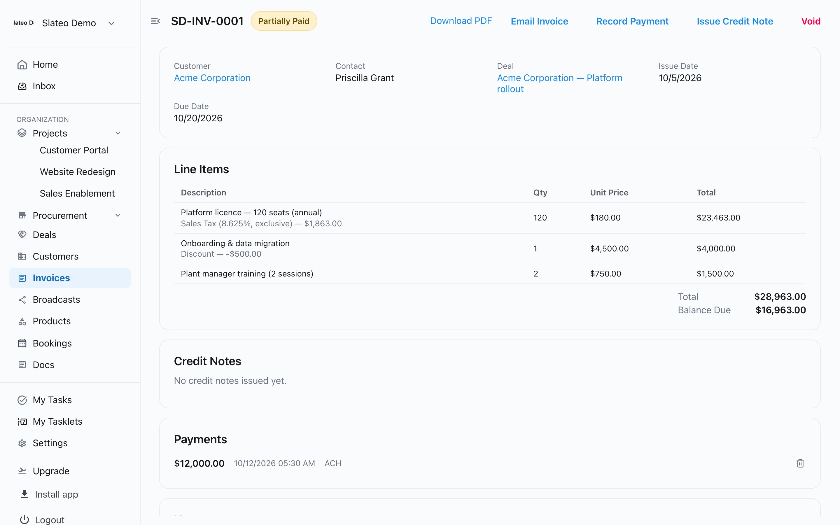 An invoice in Slateo with three line items, sales tax on one, a discount, a recorded payment and the balance due.